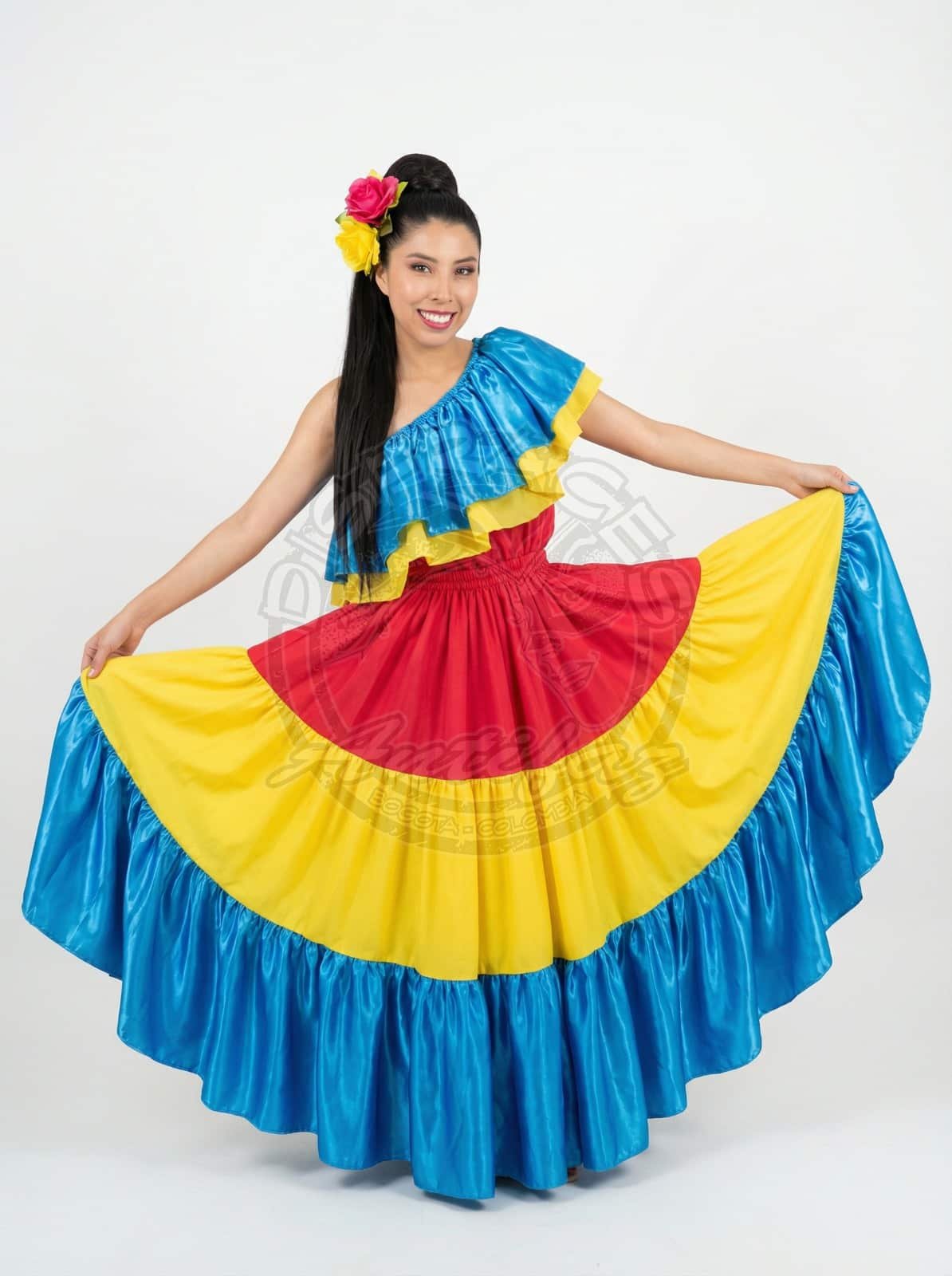 Vestido típico de bullerengue con franjas amarillas azules y rosadas para presentación cultural en Bogotá